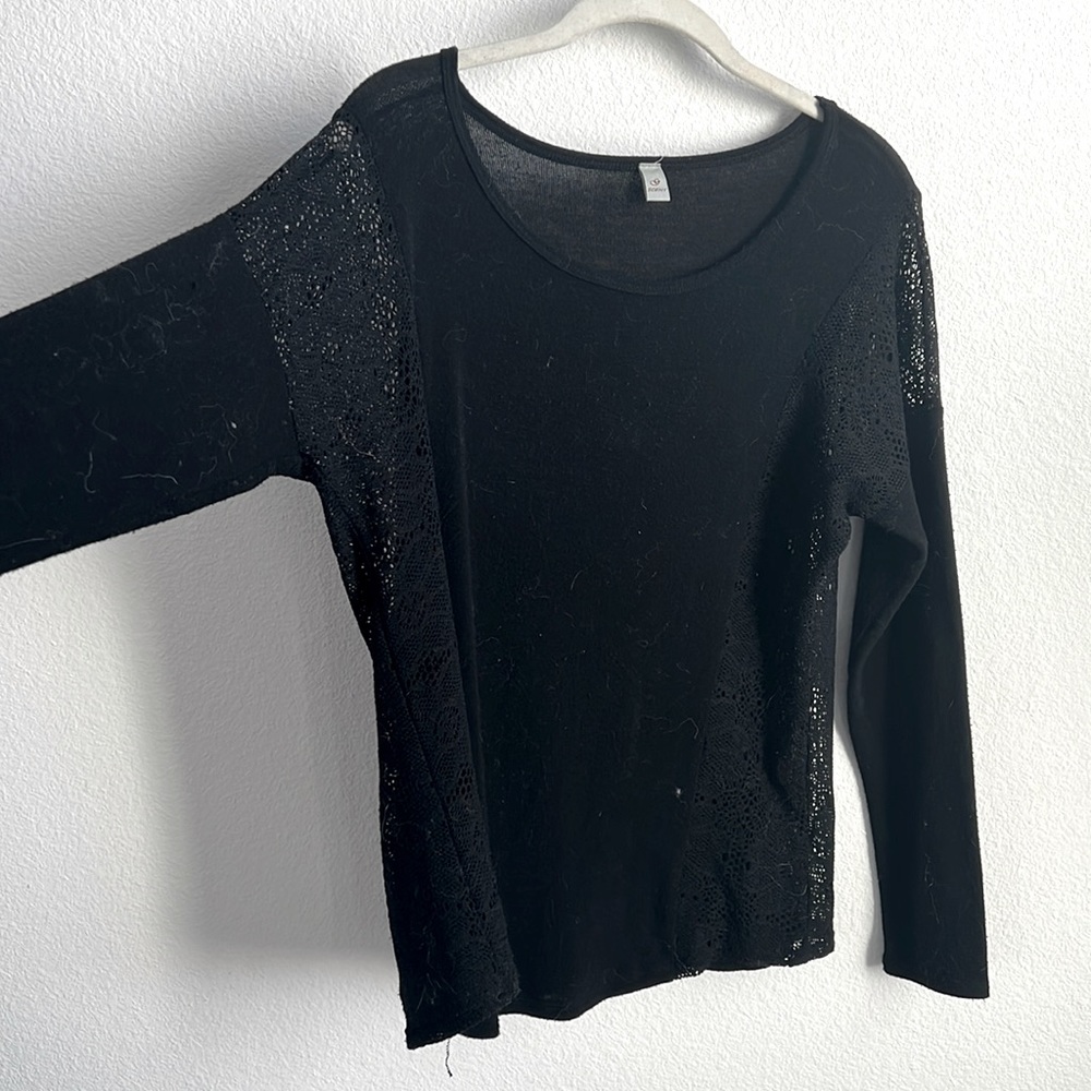 Sweater with mesh detailing on arms and paneling down torso